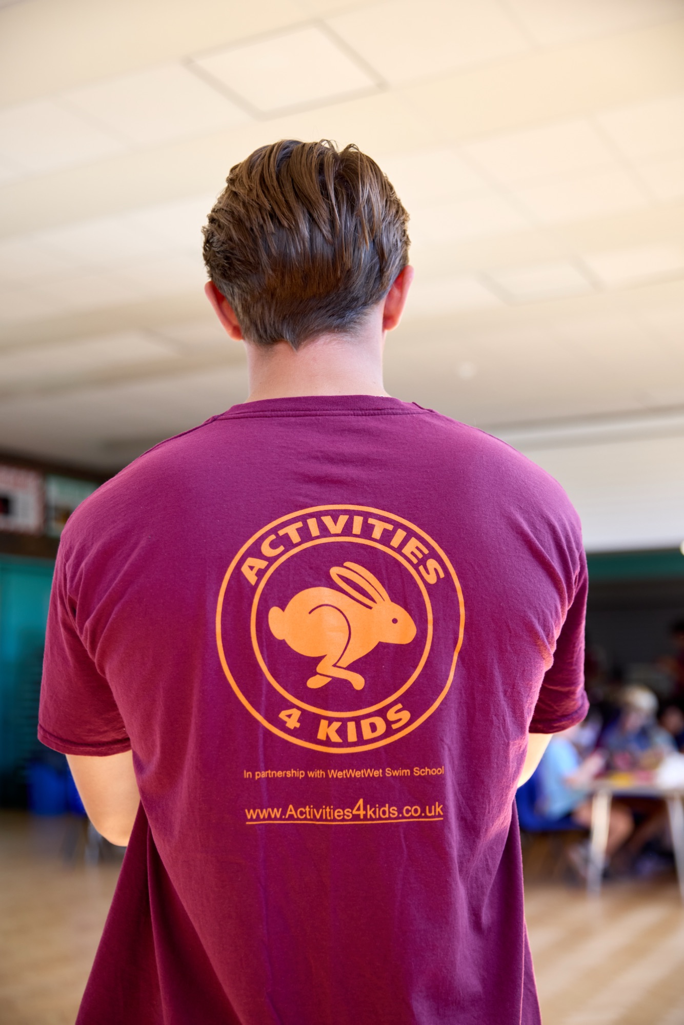 Back of an Activities 4 Kids staff t-shirt