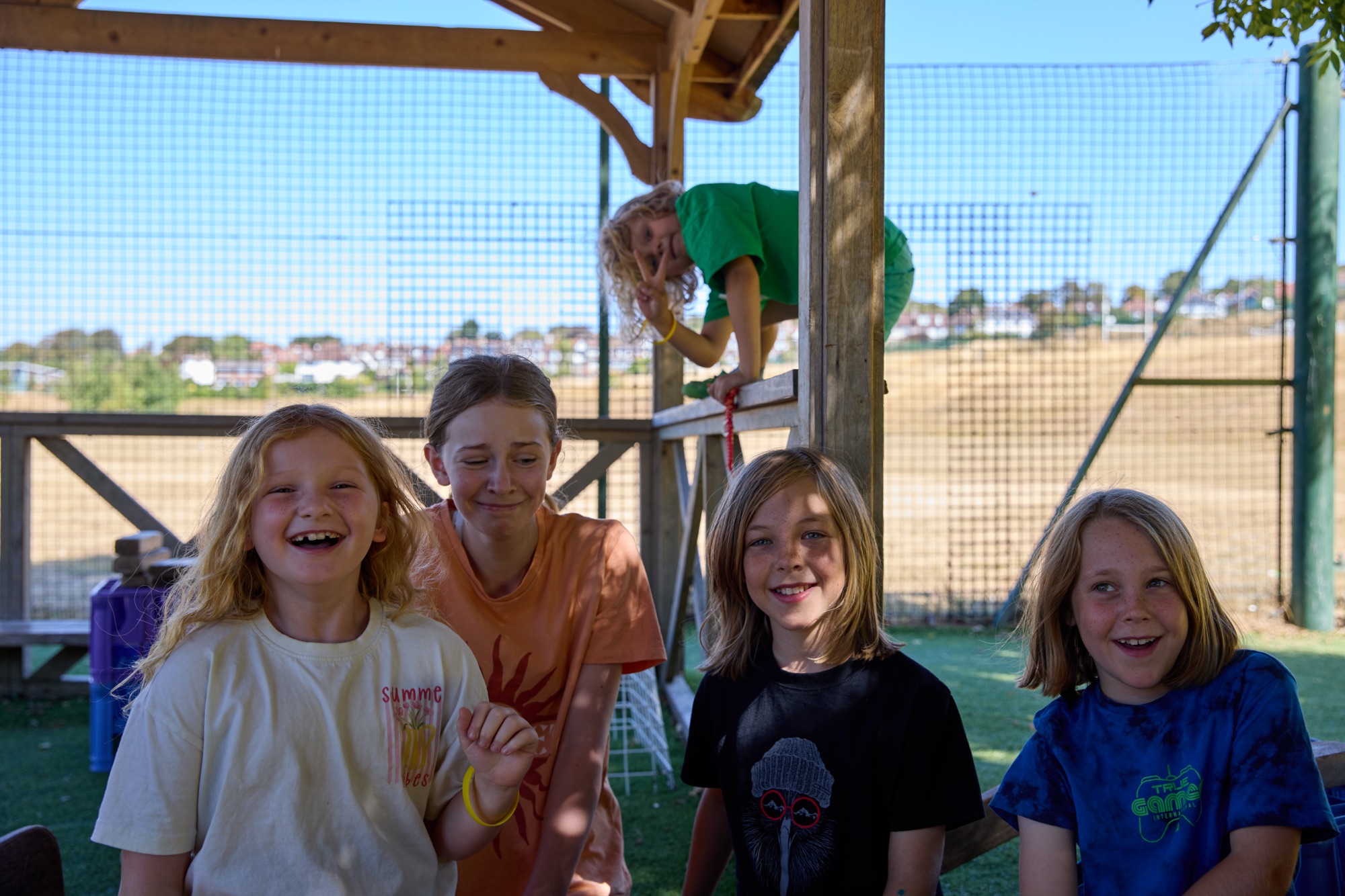 Group of children laughing together outdoors