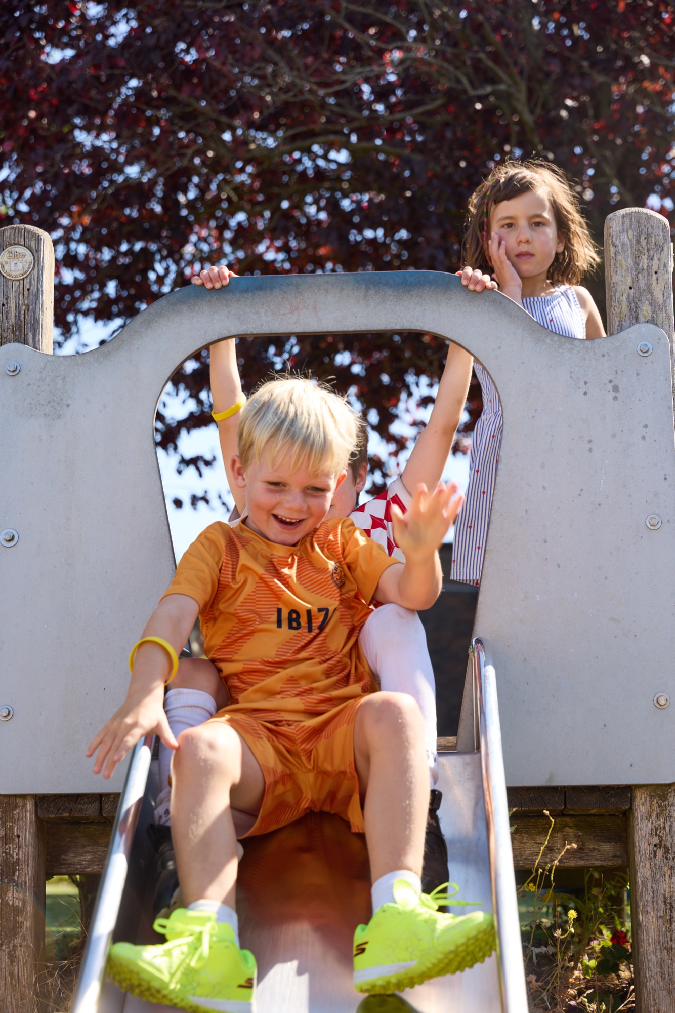 Children playing on a slide