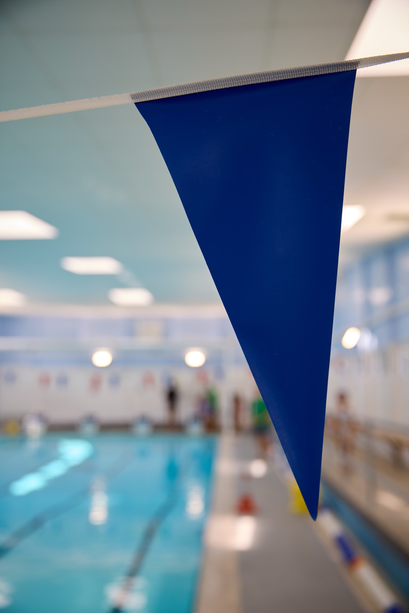 Blue bunting flag above the pool